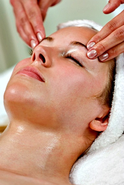 Woman Enjoying A Facial At The Spa